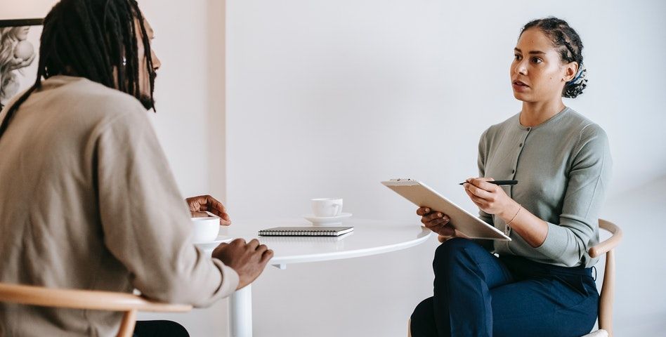 Two professionals having a conversation