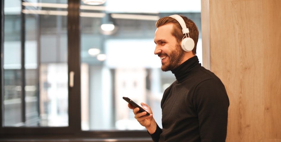 A man listening to a podcast