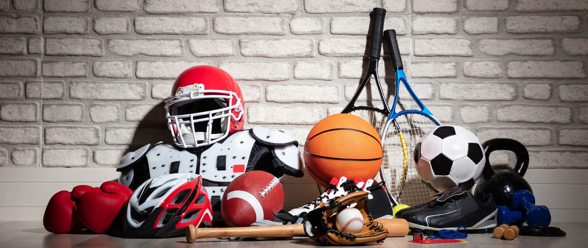 A variety of sporting equipment on the ground